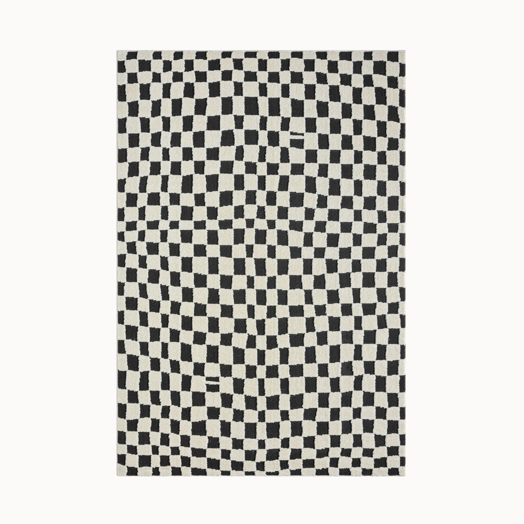 160x230cmサイズの、パイルの長短で立体的にチェック柄を表現した、アイボリー × ブラックのいびつなチェッカーパターンがキュートな、RUGHAUSのふんわりベーシックラグ Page