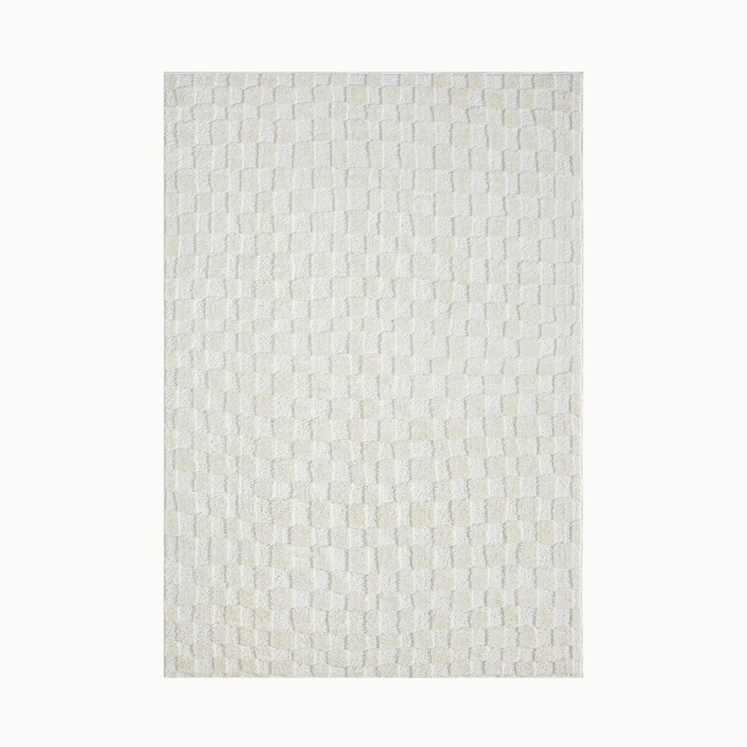 160x230cmサイズの、パイルの長短だけで立体的にチェック柄を表現した、アイボリーのチェッカーパターンがさりげなくチャーミングな、RUGHAUSのふんわりベーシックラグ Nino