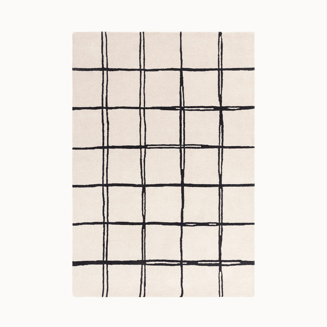 160x230cmサイズの、ホワイト×ブラック色のラフに描かれた格子パターンが可愛らしい、シンプルながらもセンスがきらりと光る、天然素材ウール100％製RUGHAUSのハンドタフトラグ Ane