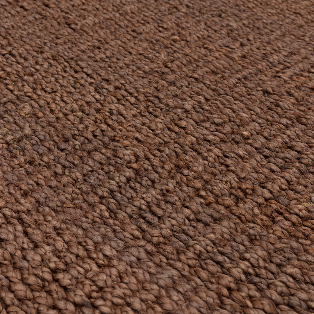 落ち着いたアーシーカラー、ブラウンの色合いとざっくりとしたナチュラルな風合いが素敵なRUGHAUSの手織りリバーシブル仕様天然エコ素材ジュート製ラグの素材感がわかるクロースアップ