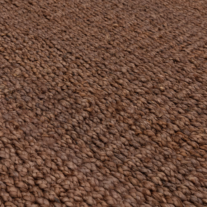 落ち着いたアーシーカラー、ブラウンの色合いとざっくりとしたナチュラルな風合いが素敵なRUGHAUSの手織りリバーシブル仕様天然エコ素材ジュート製ラグの素材感がわかるクロースアップ