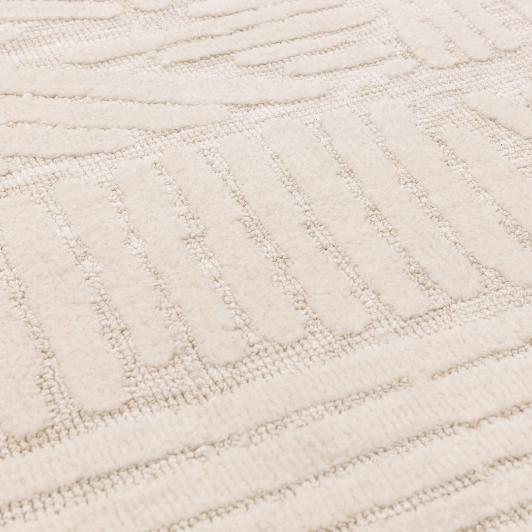 ふわふわアイボリー・オートミール色ラグの優しいイメージに、コンテンポラリーなタッチを加えた、RUGHAUSのマイクロファイバーポリエステル製モダンアートラグ Paavoの素材感がわかるクロースアップ